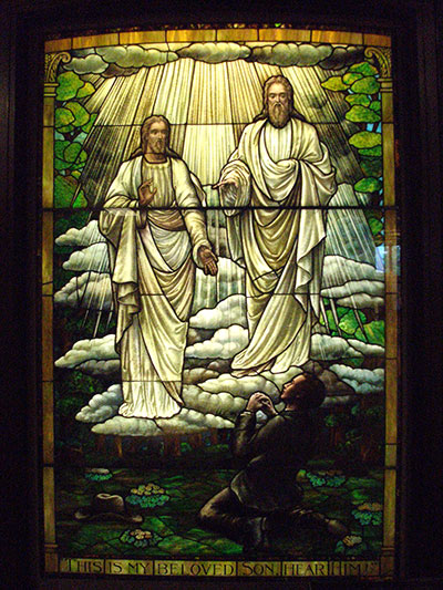 Stained glass depiction of the first vision in the Church History Museum. Image via latterdaysense.org