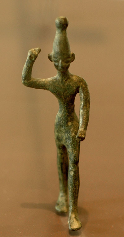 Bronze figure of the Canaanite storm god Baal. The figure would have very likely been holding a bolt of lightning in his raised hand. Image via Wikimedia commons.