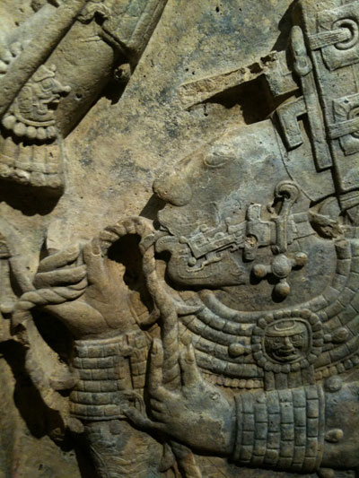 Detail from the Yaxchilan lintel depicting a bloodletting using a person's tongue.