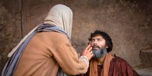 Jesus healing a blind man. Image via lds.org